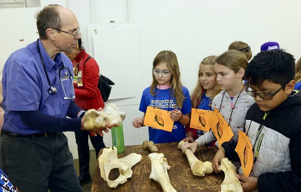 Grant Jones talks to Mrs. Lockwood's third-grade class from Island Elementary about animal husbandry. 